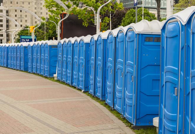 a line of brightly-colored portable restrooms, perfect for outdoor festivals and concerts in Adamsville, AL